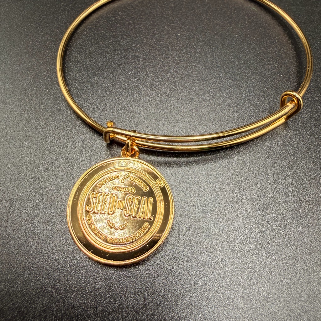 Young Living Gold Tone Seed To Seal Charm Bangle Bracelet